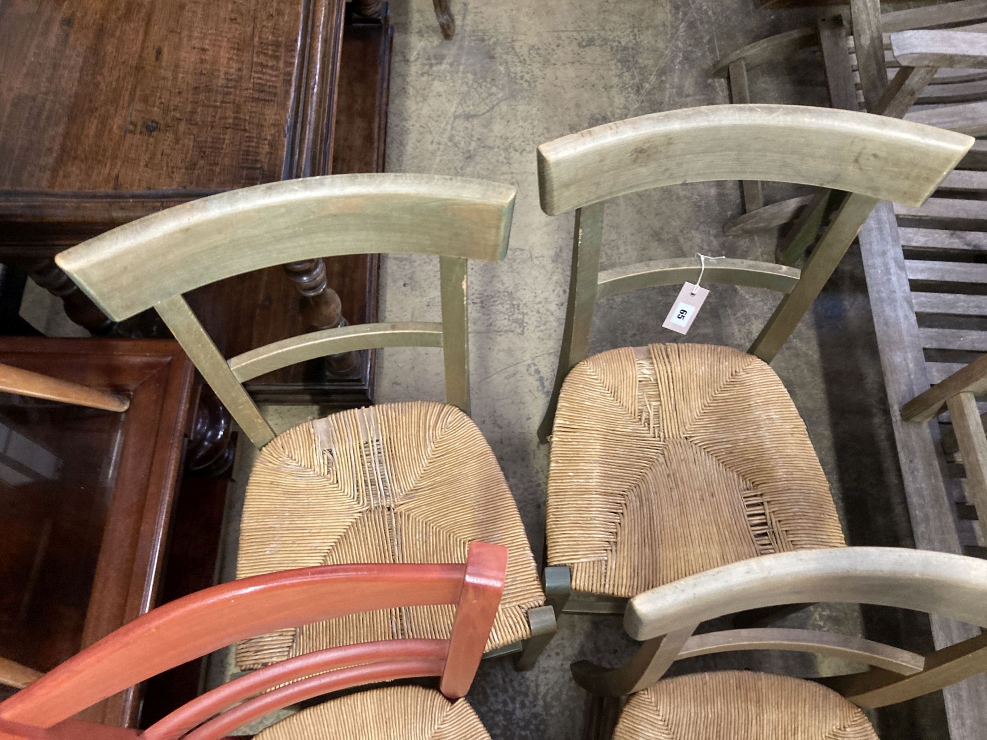 Six (four plus two) French stained beech rush seated dining chairs